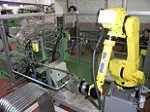 Fanuc-robot ponst en stapelt aluminium featured image